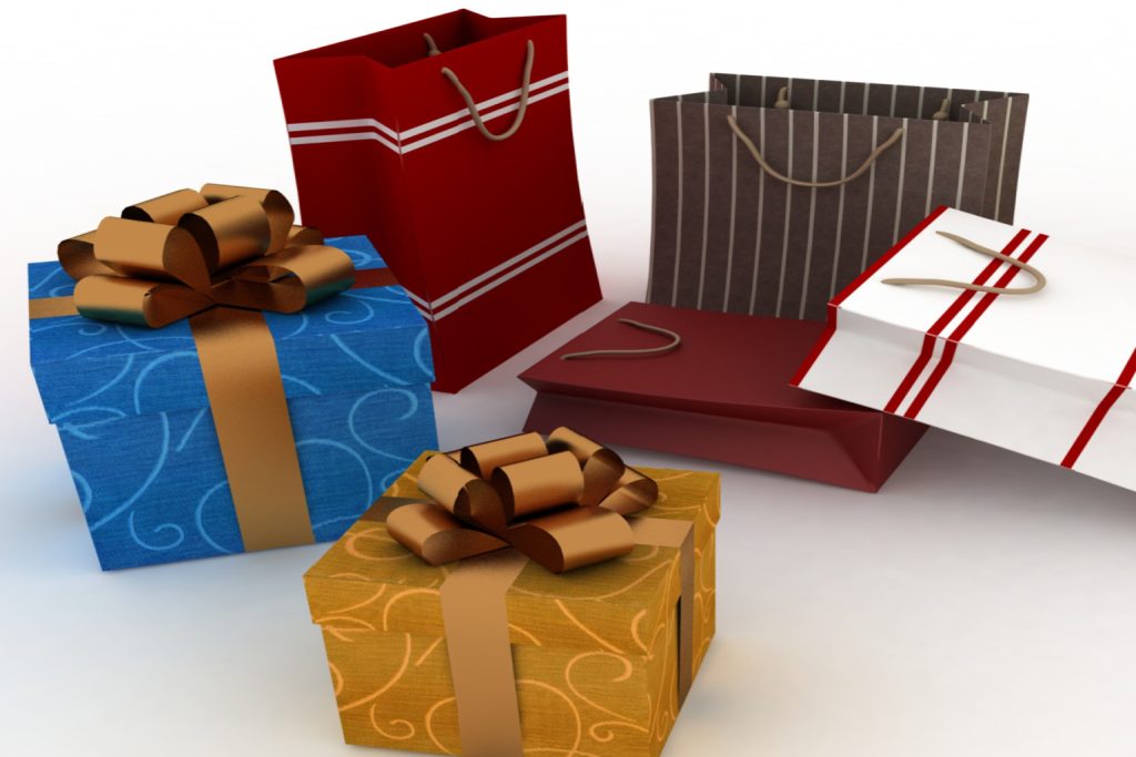 elaborately wrapped gifts and gift bags in dark colors.