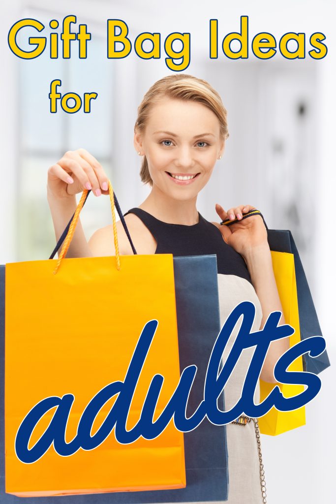 smiling woman holding yellow and blue gift bags.